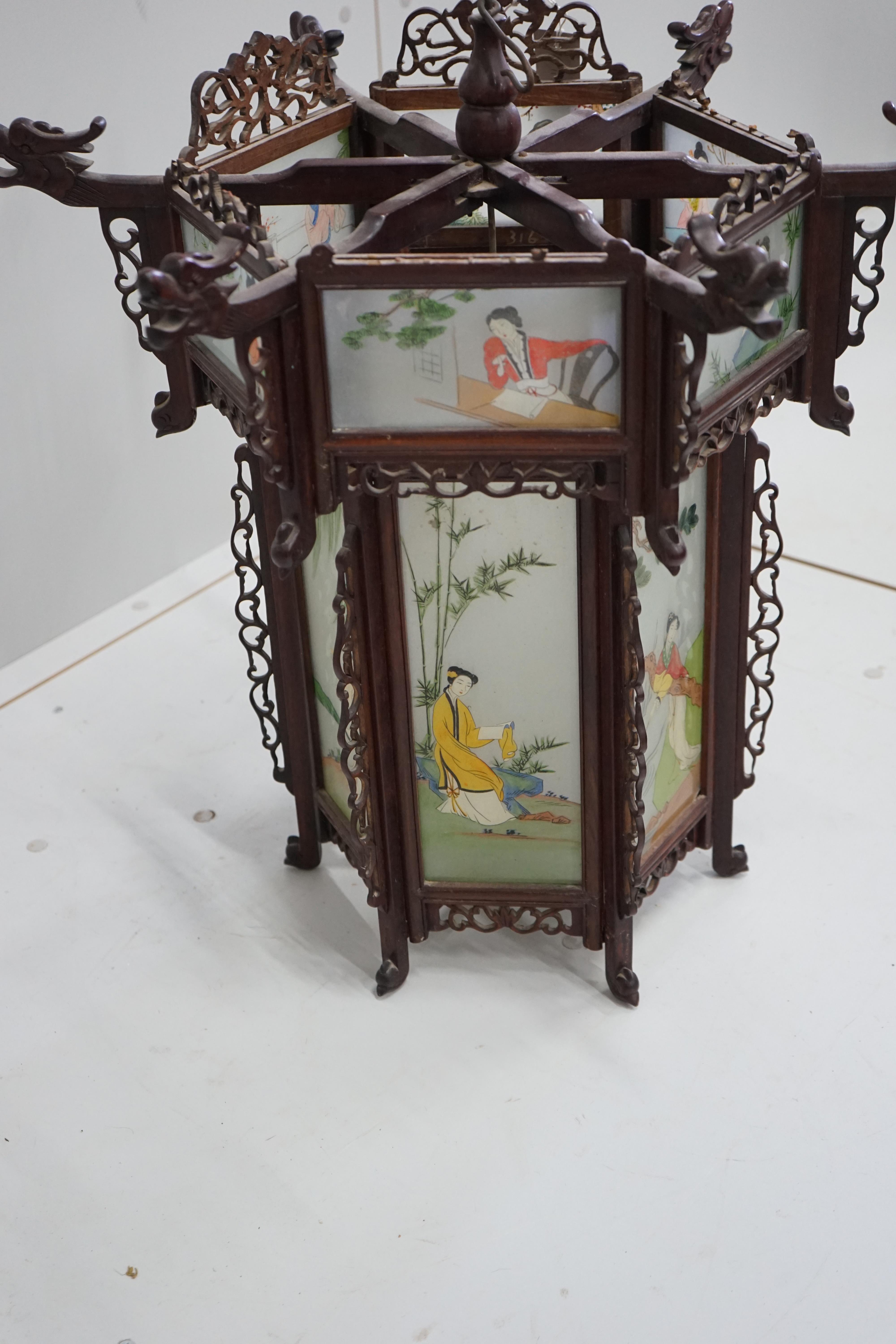 A Chinese hexagonal glass and hardwood lantern, width 62cm, height 58cm